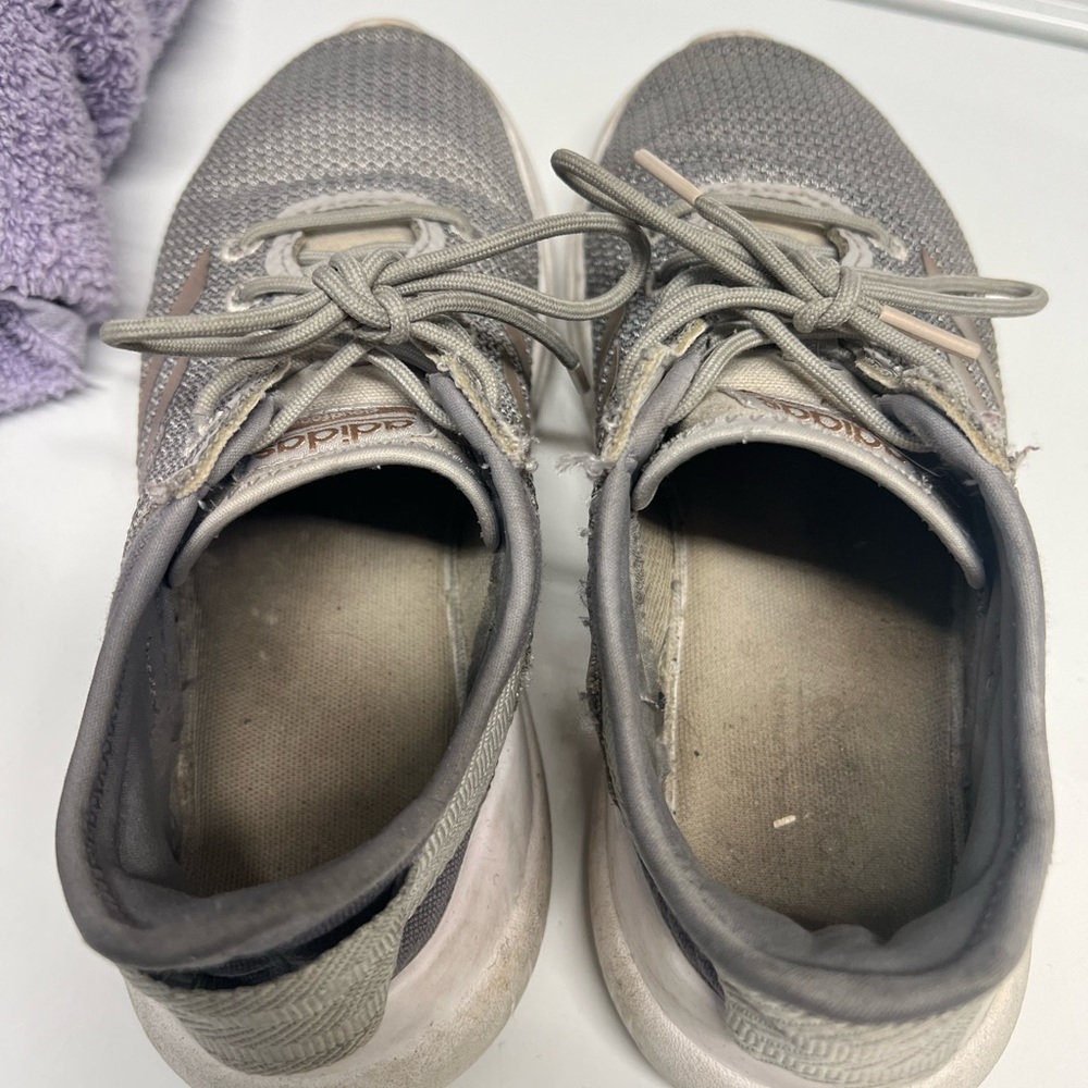 Well worn adidas sneakers